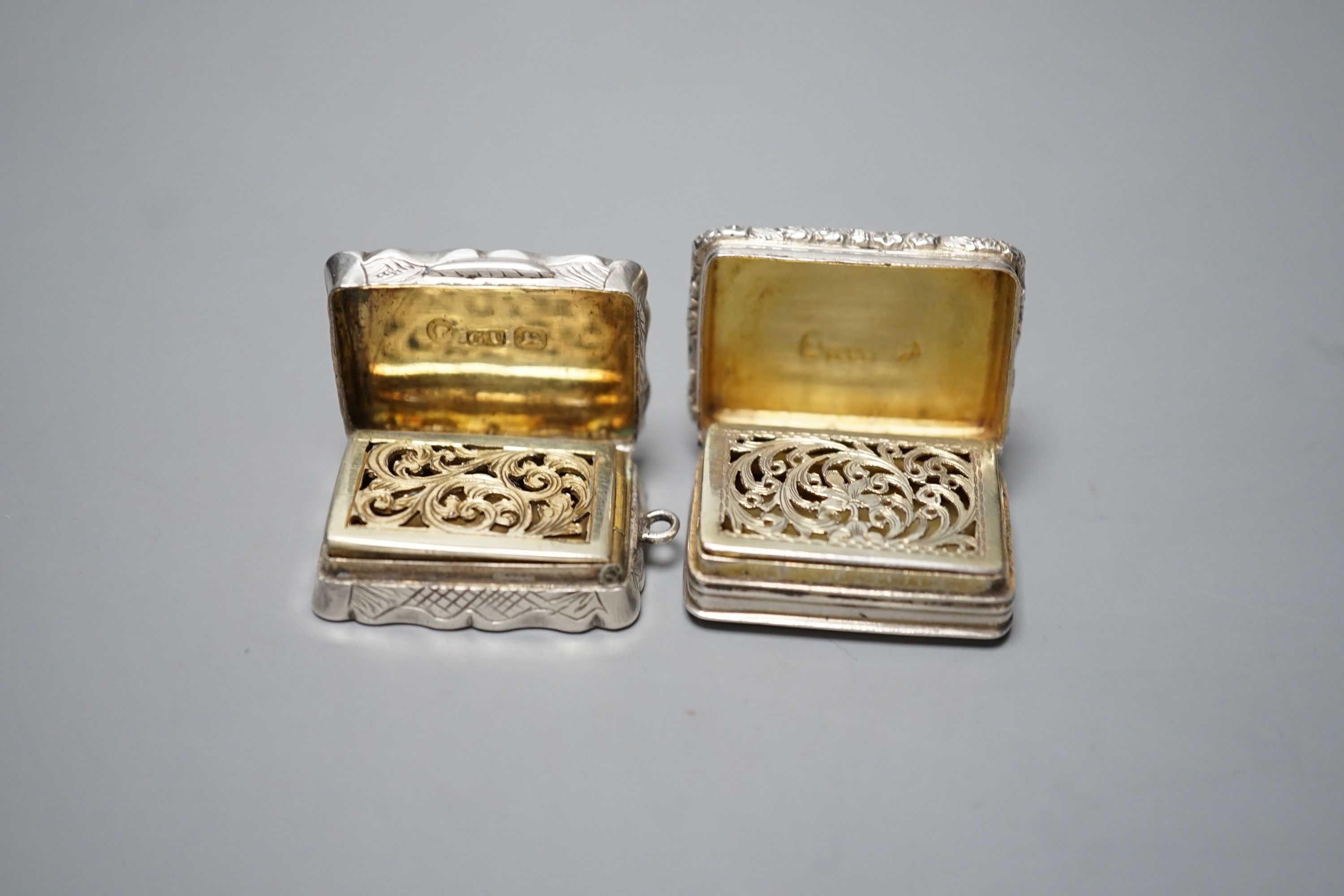 A George IV engine turned silver rectangular vinaigrette, Thomas & William Simpson, Birmingham, 1823, 30mm and a later silver vinaigrette by George Unite, Birmingham, 1866, engraved with the name 'Emmie', 29mm.